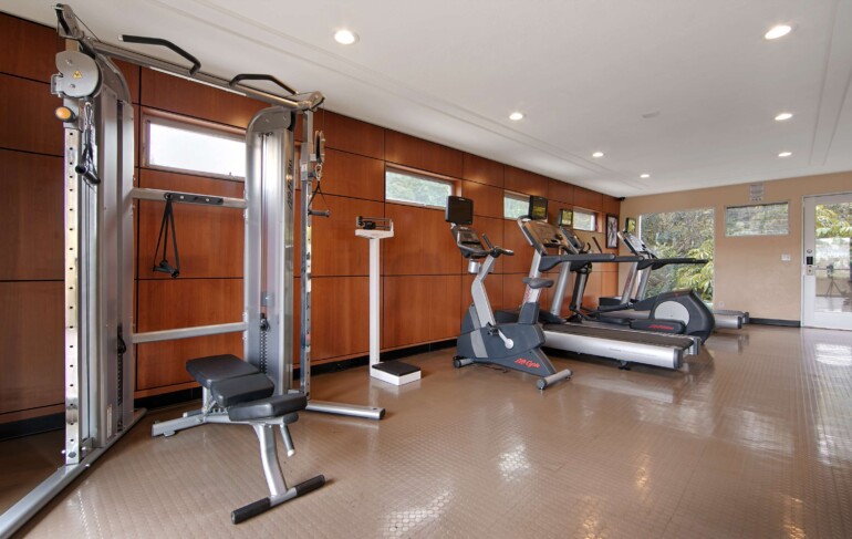 Fitness center with pulley home gym, scale, elliptical, exercise bike and treadmills